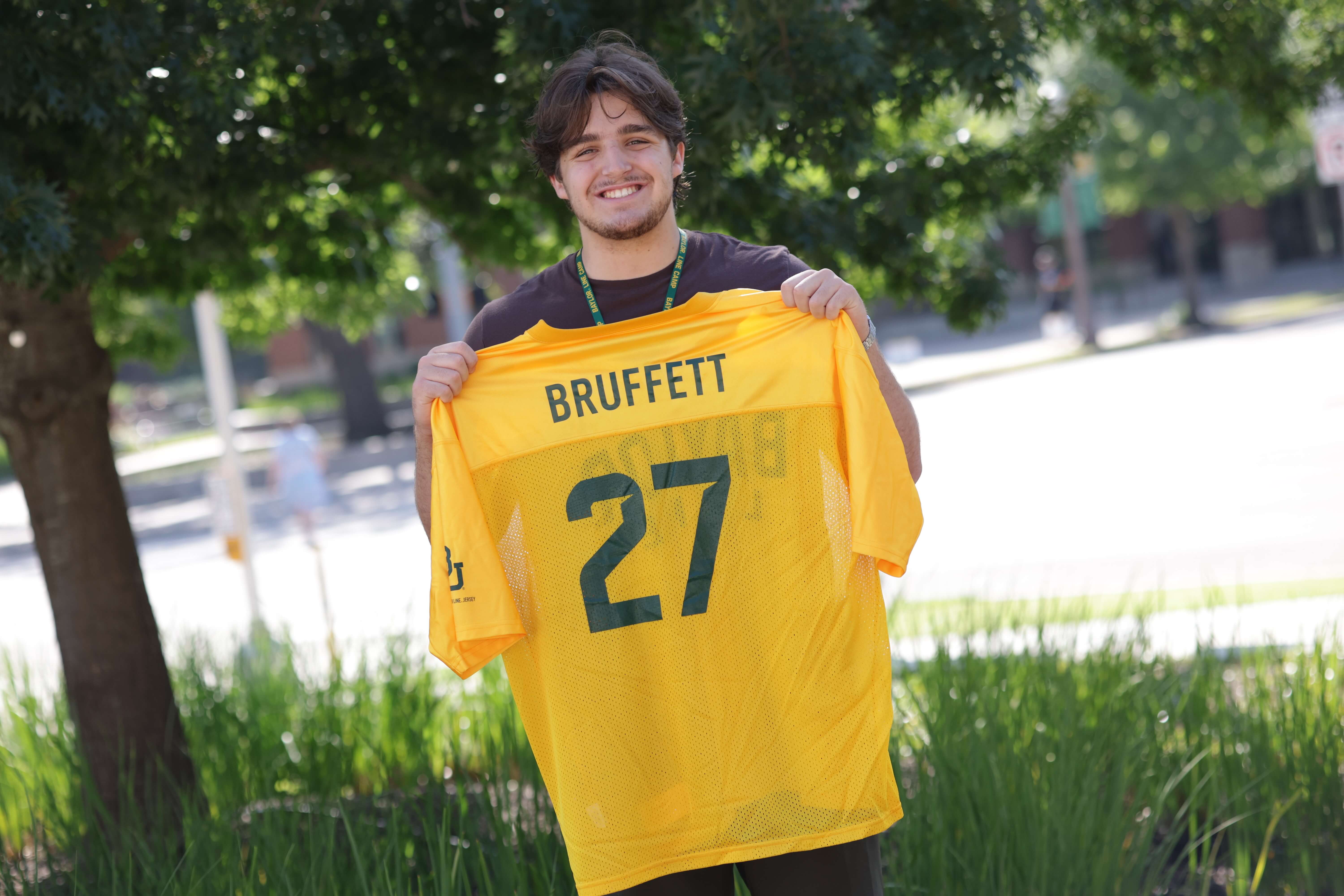 Bruffet holding Baylor line jersey 