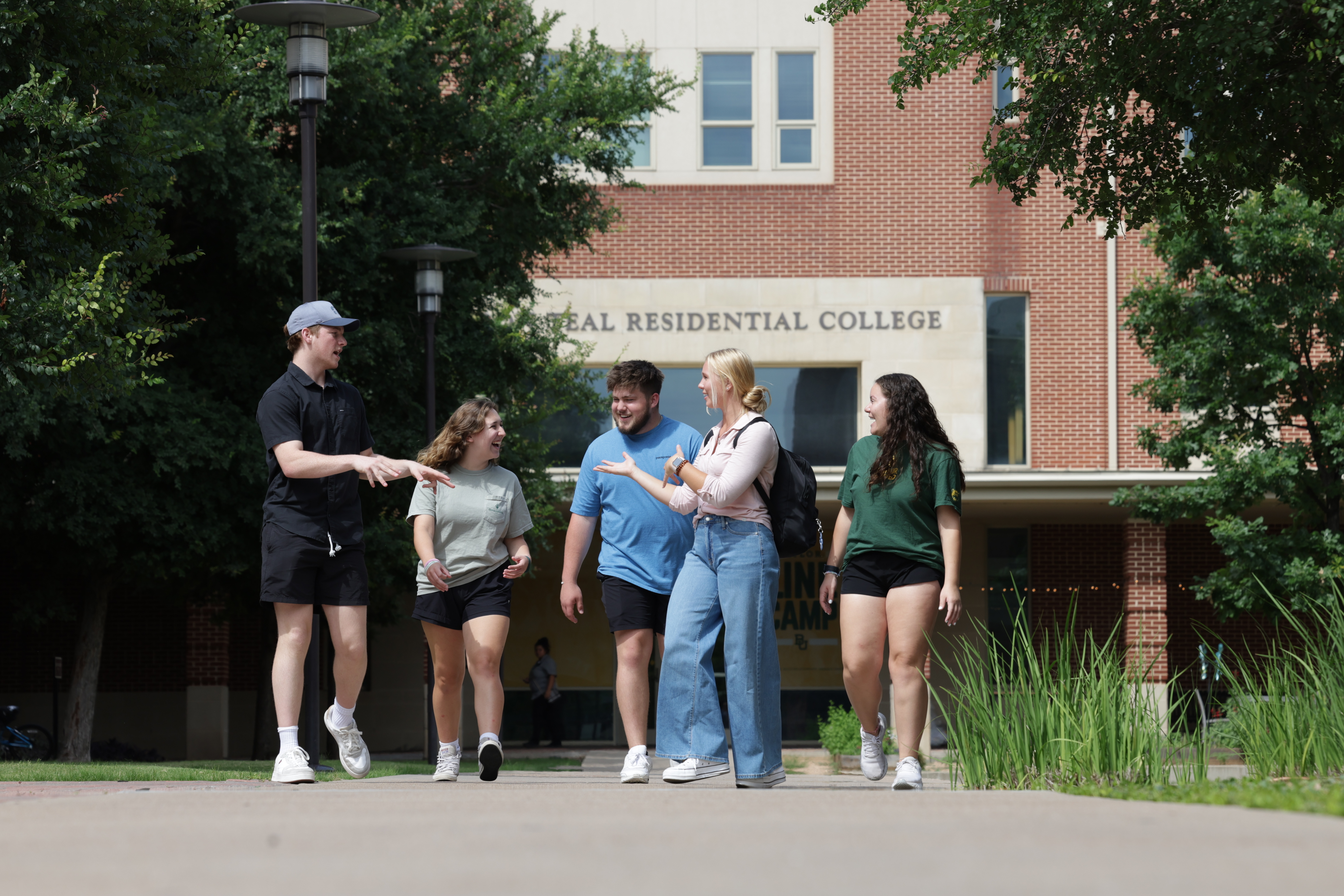 five students walking on Baylor's campus 