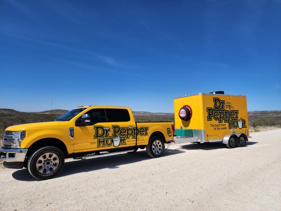 Dr Pepper Hour Tour Baylor-branded truck and trailer on the road in West Texas