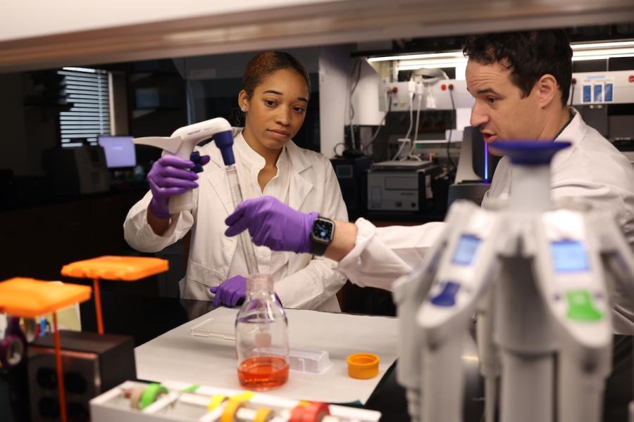 A Baylor student conducts research in a lab with Baylor professor.